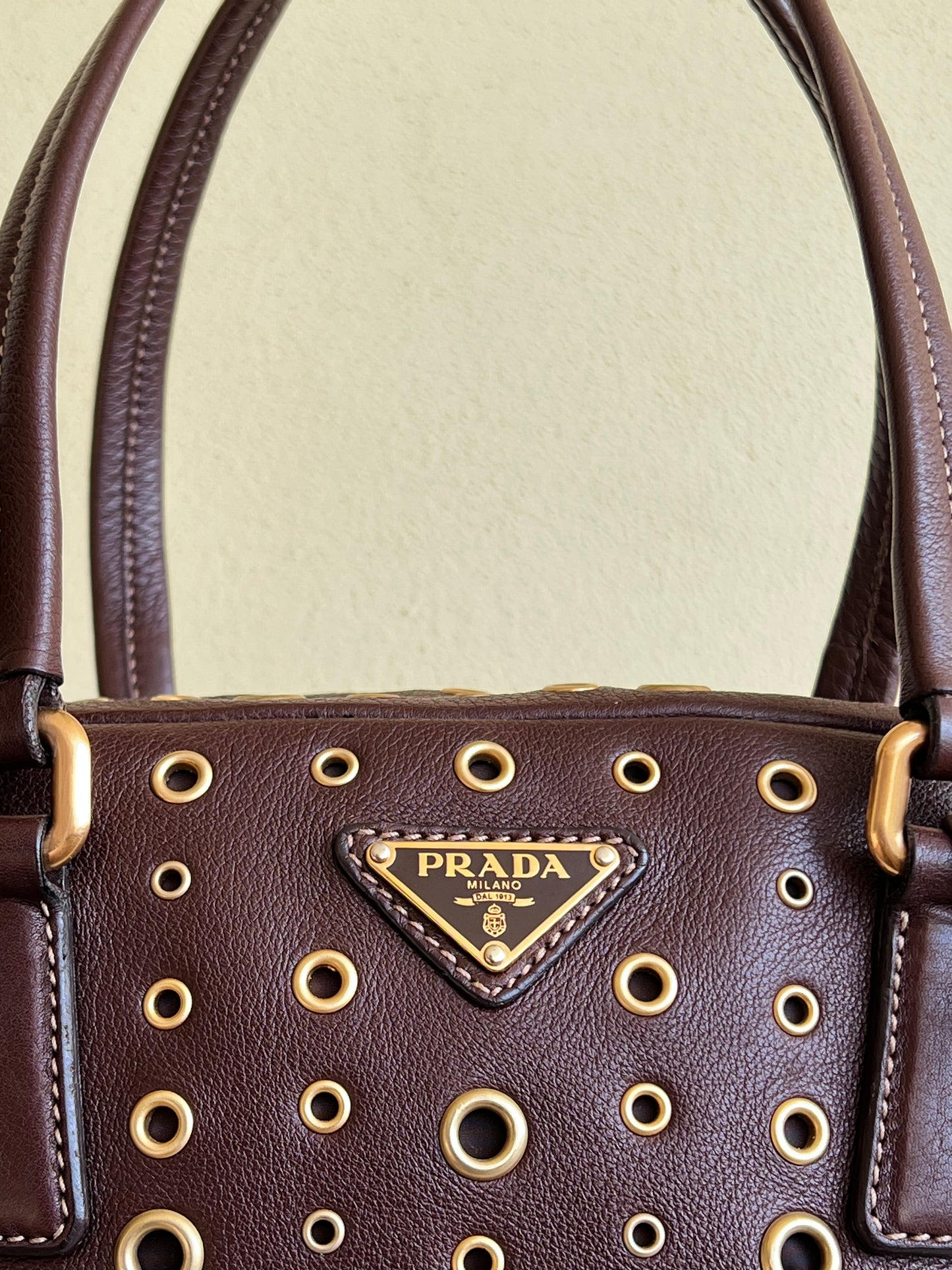 Prada gold studs