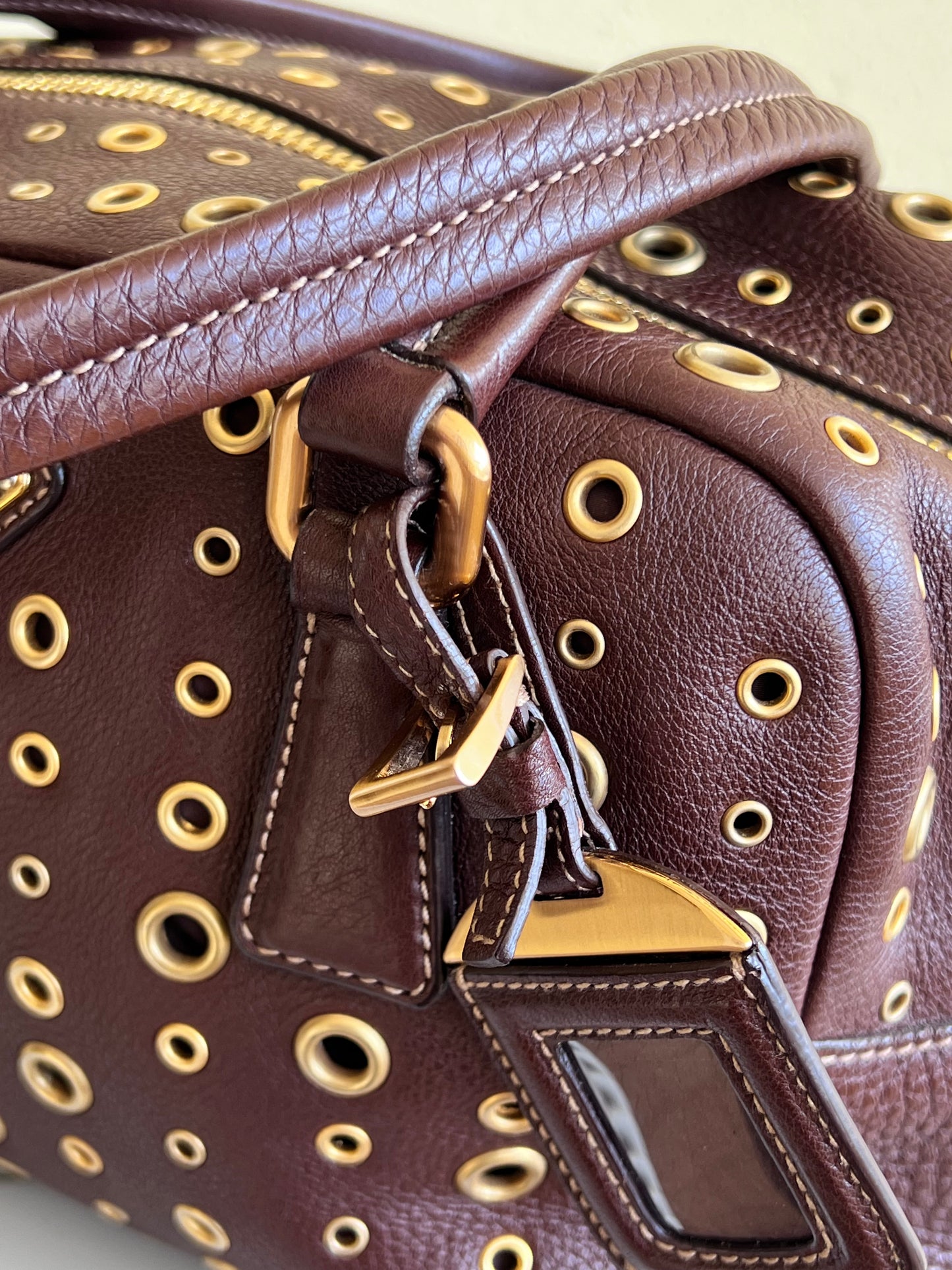 Prada gold studs