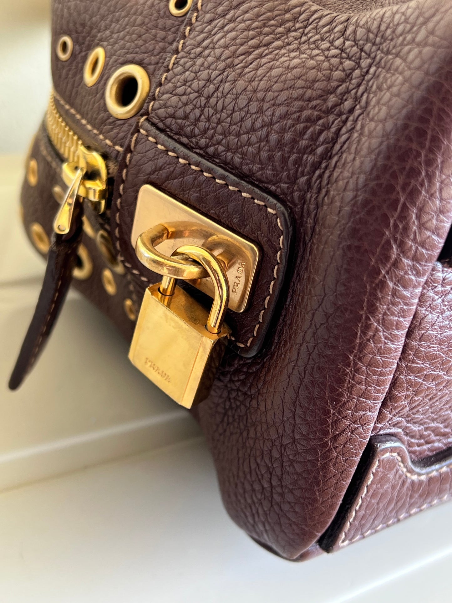 Prada gold studs