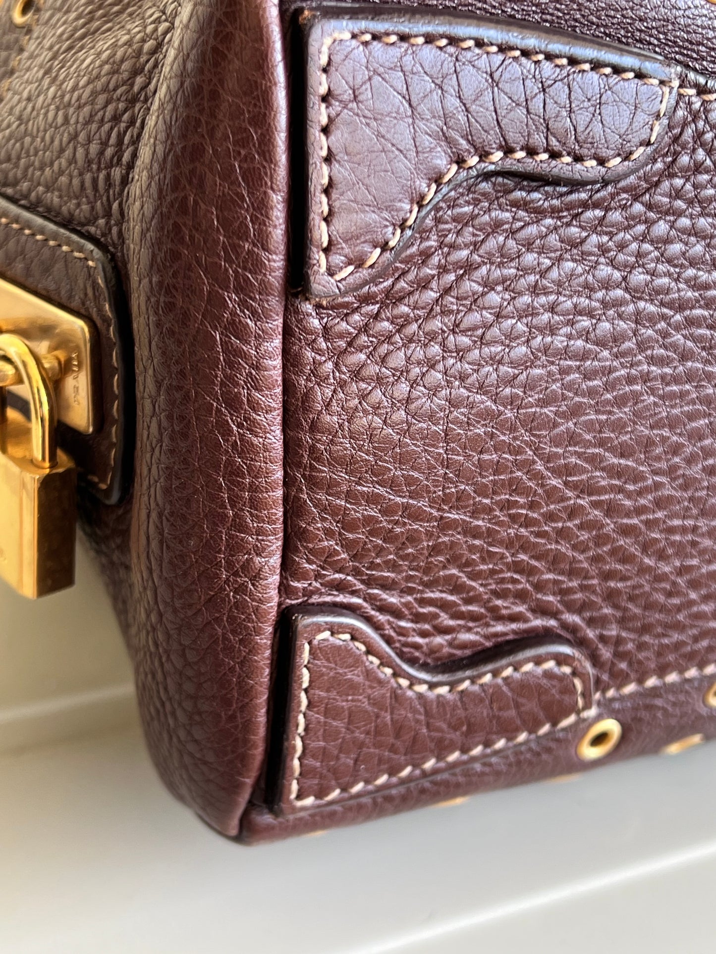 Prada gold studs
