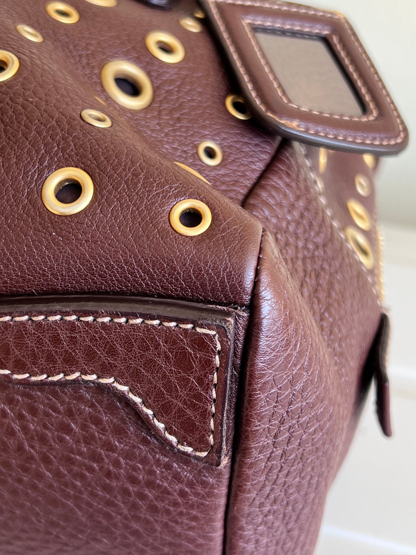 Prada gold studs
