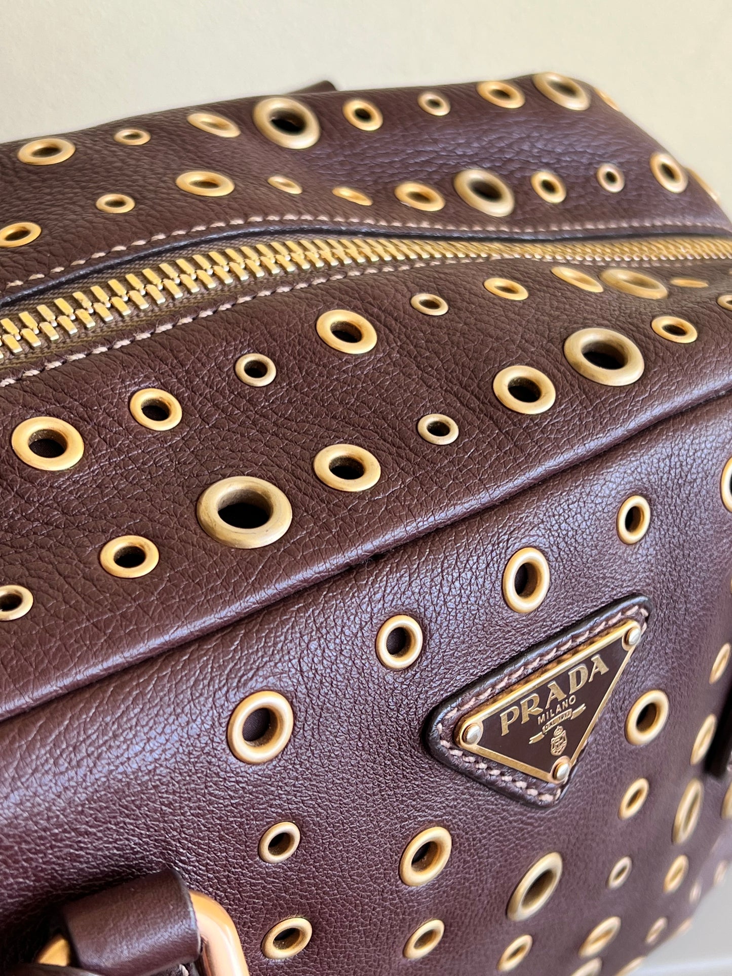 Prada gold studs