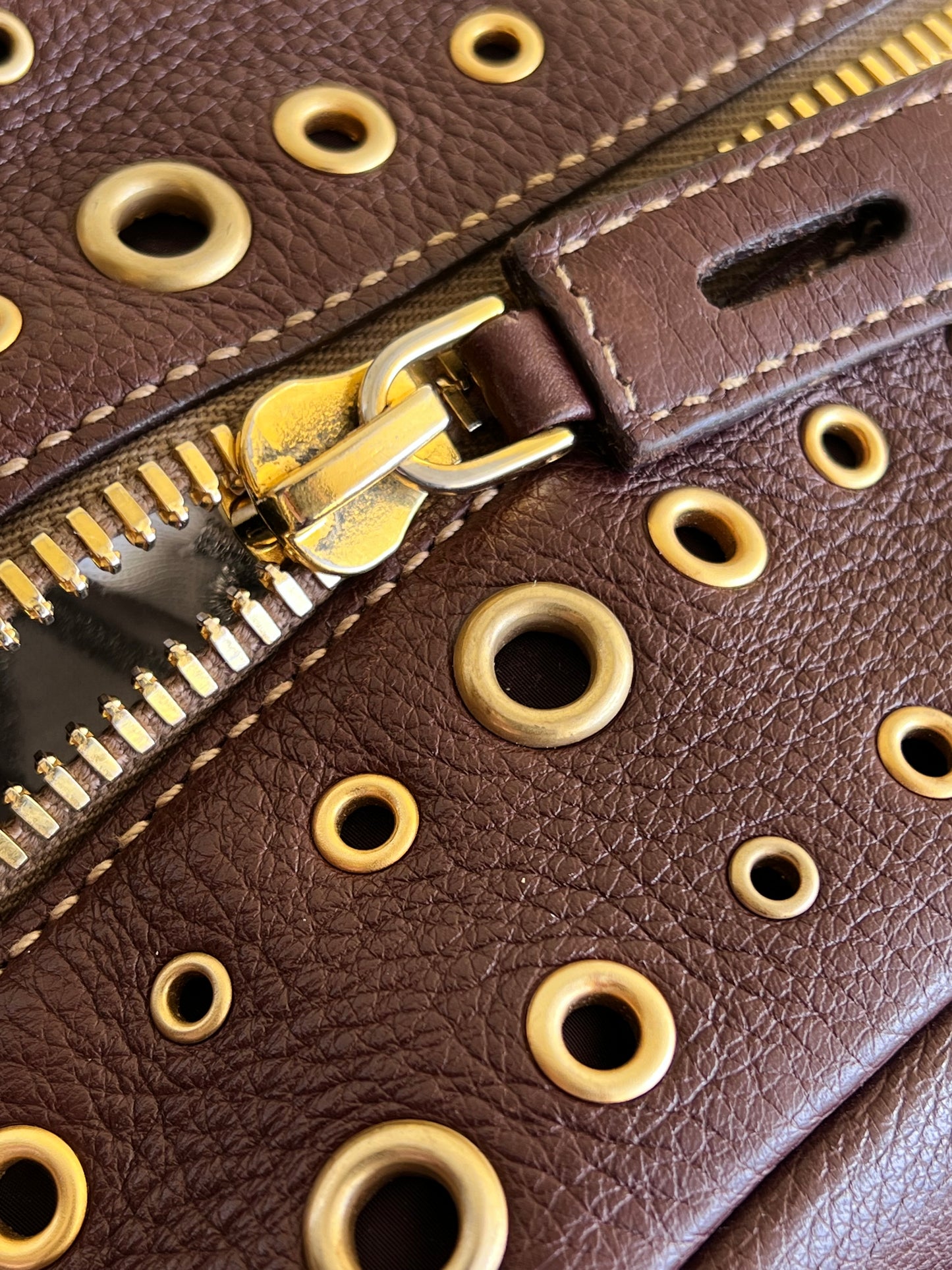 Prada gold studs